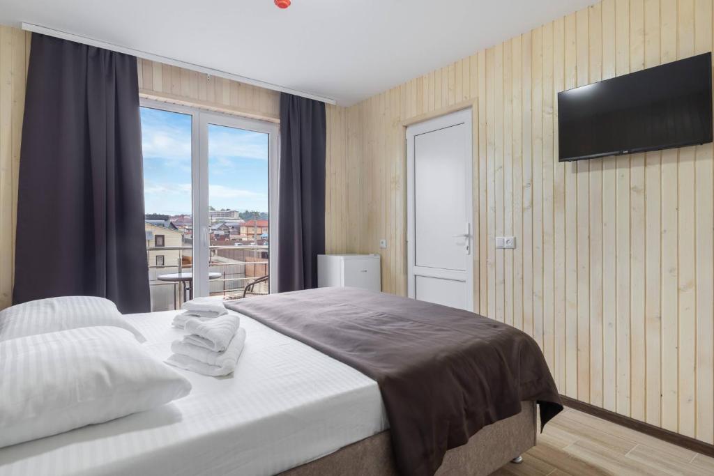 Postel nebo postele na pokoji v ubytování VASOK Hotel NEW 2025