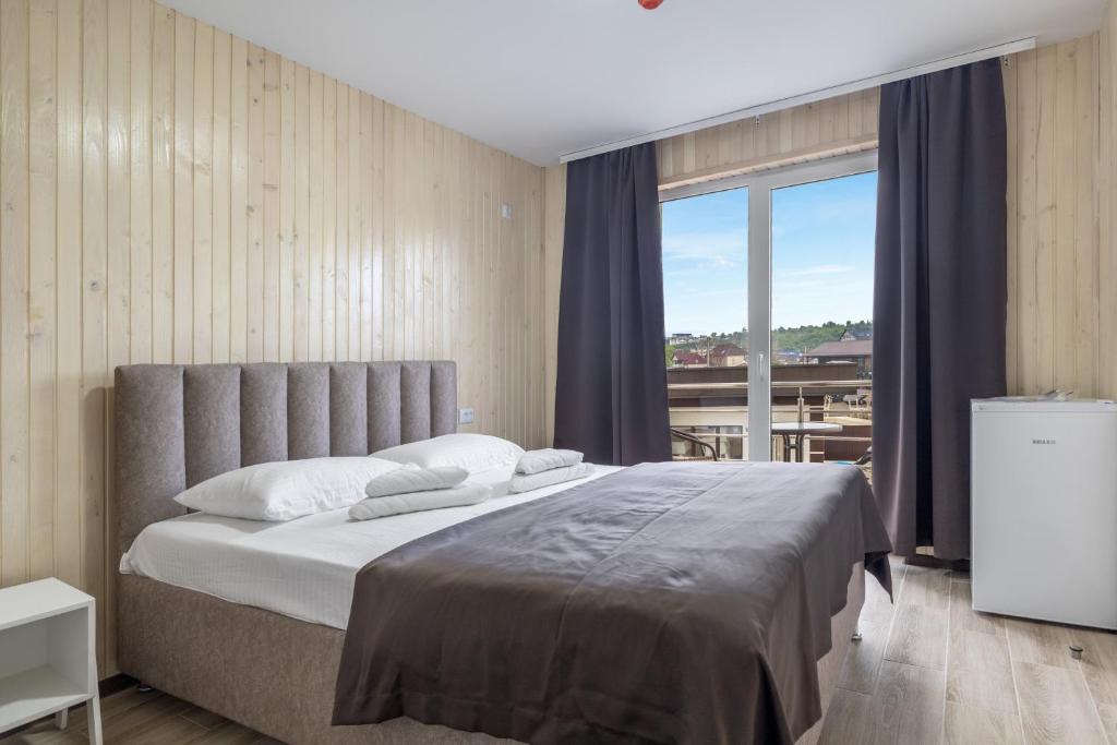 Postel nebo postele na pokoji v ubytování VASOK Hotel NEW 2025