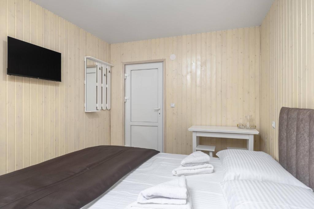 Postel nebo postele na pokoji v ubytování VASOK Hotel NEW 2025