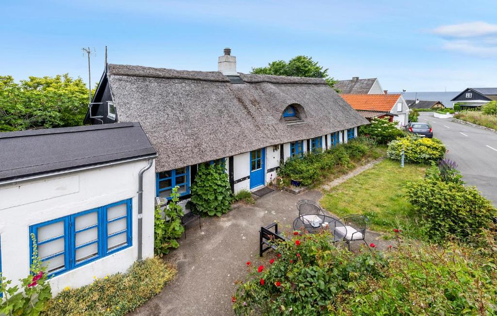 an aerial view of a house with a roof at Cozy Home In Allinge With Kitchen in Allinge