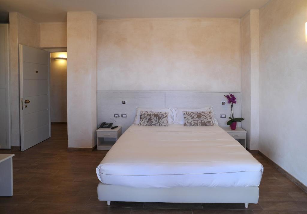 Postel nebo postele na pokoji v ubytování Agriturismo La Camilla
