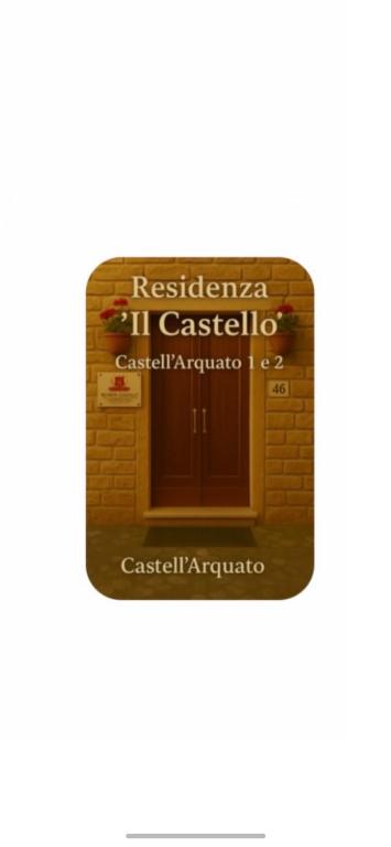 a door in a brick wall with a sign on it at Residenza Il Castello Uno e Due in CastellʼArquato