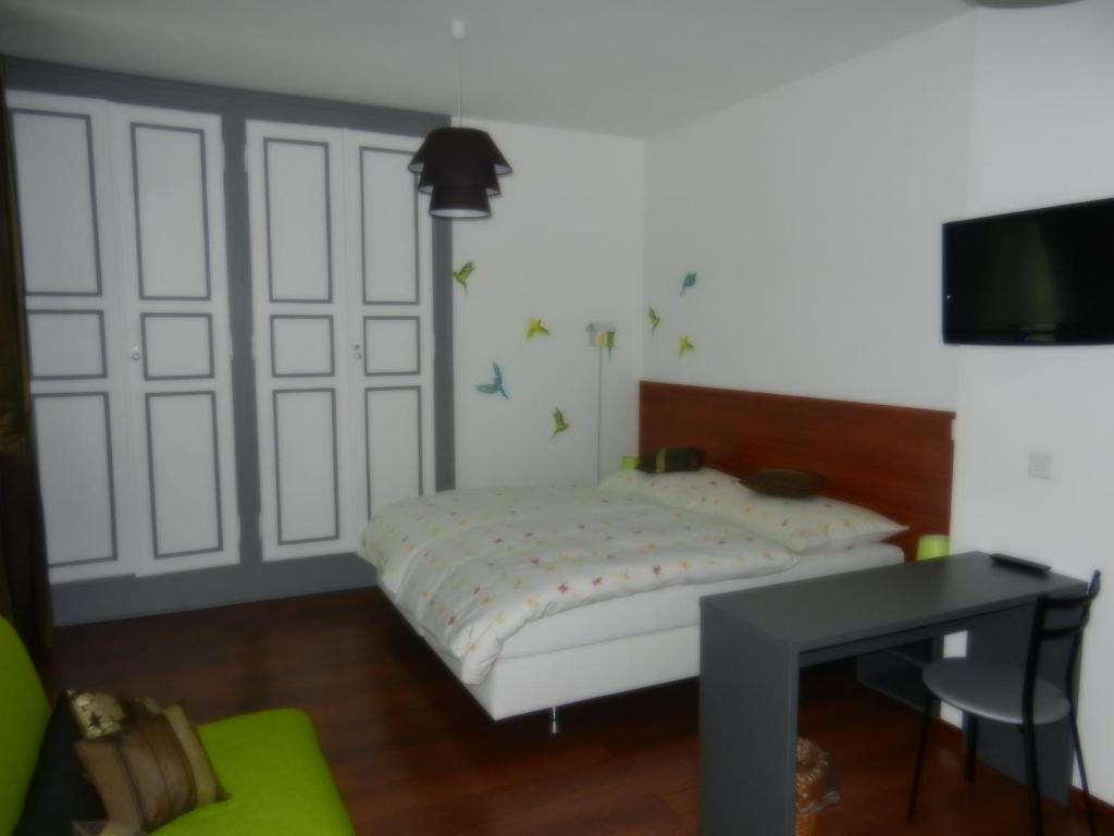 Postel nebo postele na pokoji v ubytování Hôtel Terminus