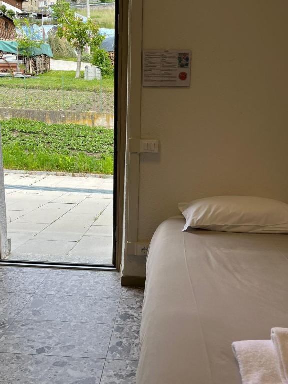 Postel nebo postele na pokoji v ubytování foresteria ca' mon
