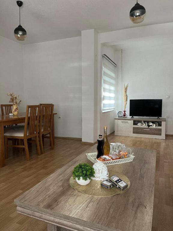 a living room with a table with food on it at Apartment MJ in Čapljina