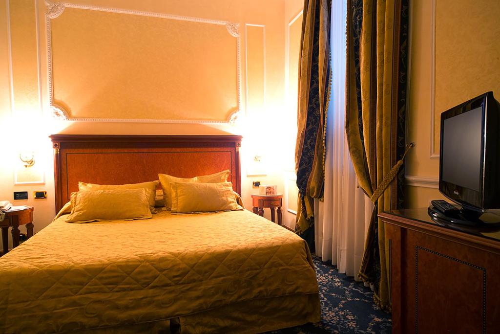 Postel nebo postele na pokoji v ubytování Hotel dei Consoli Vaticano
