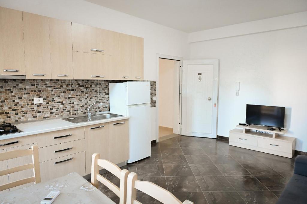 Kuchyň nebo kuchyňský kout v ubytování Shengjin Apartments