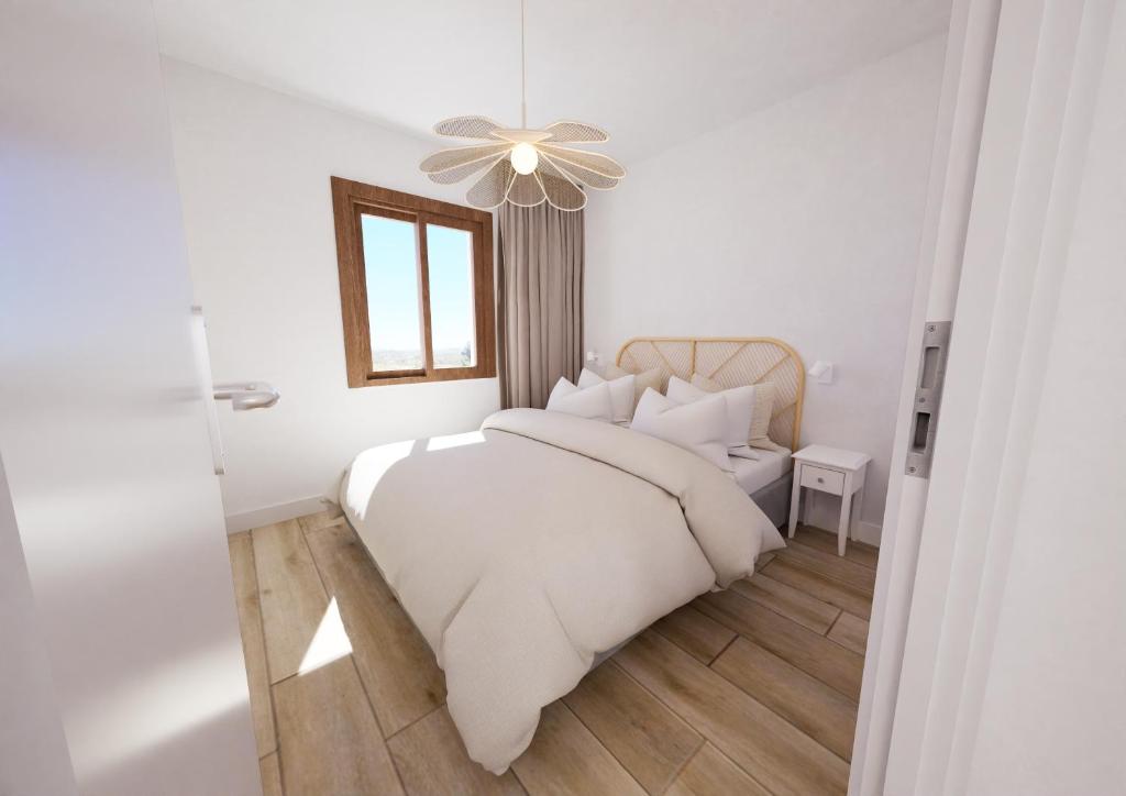 Postel nebo postele na pokoji v ubytování Mas Boronat Resort