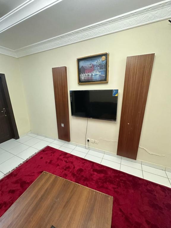 TV a/nebo společenská místnost v ubytování نجوم السلامة