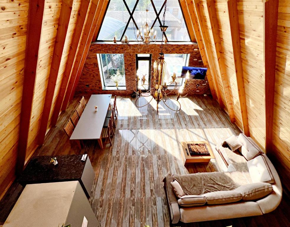 an overhead view of a living room in a tree house at NatureNest A-Frame Cabin in Gabala