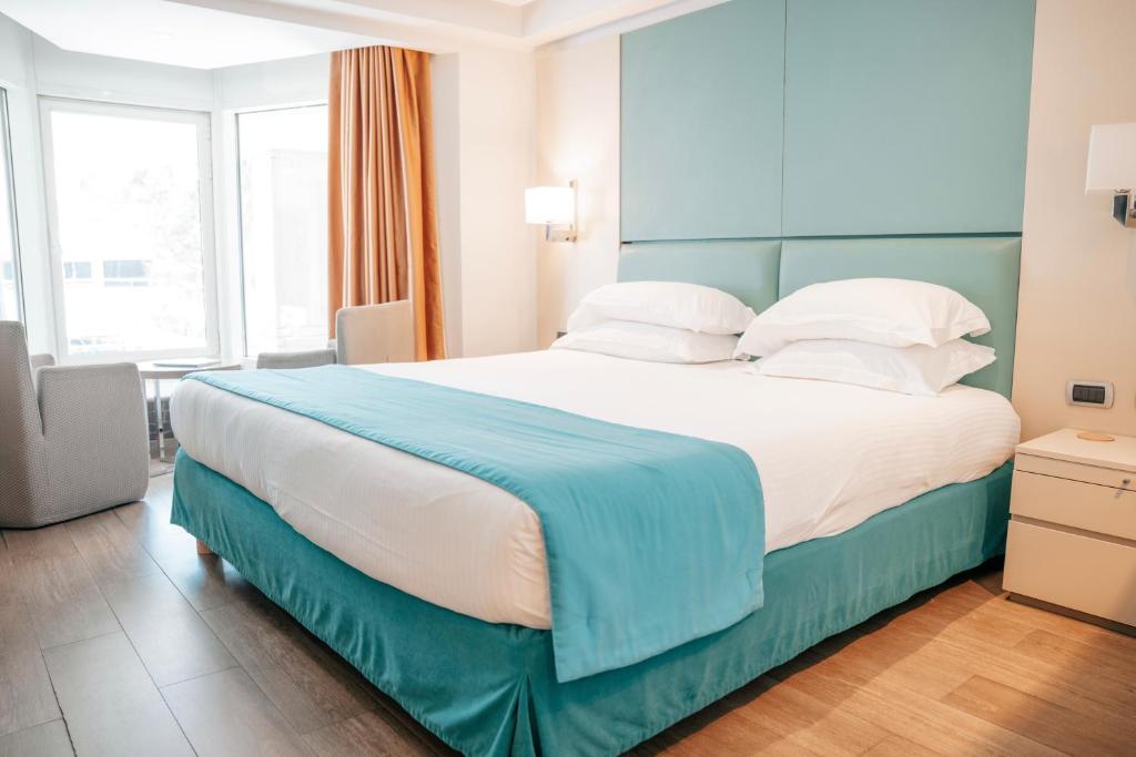 Postel nebo postele na pokoji v ubytování Port Palace