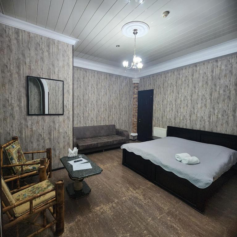 Postel nebo postele na pokoji v ubytování Hotel Piza