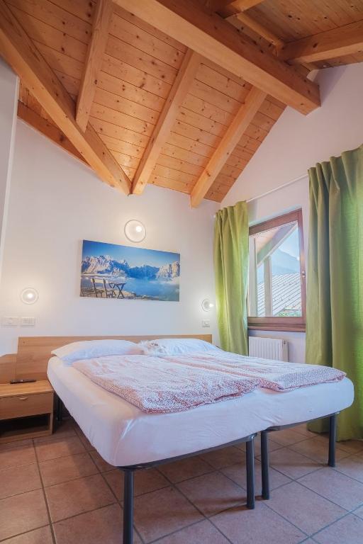 Postel nebo postele na pokoji v ubytování APARTHOTEL STREMBO