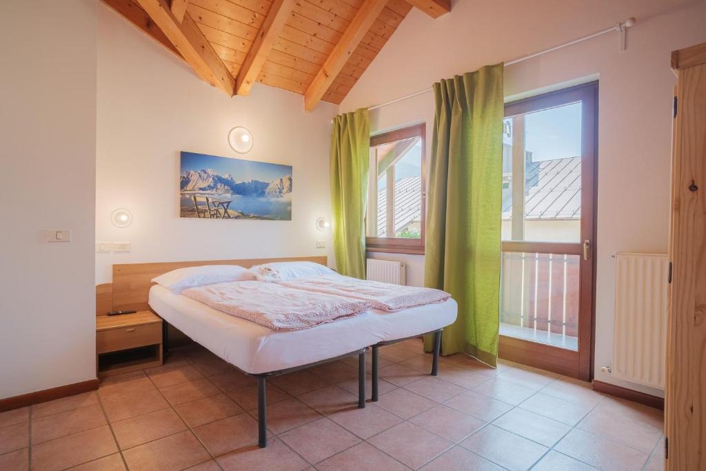 Postel nebo postele na pokoji v ubytování APARTHOTEL STREMBO