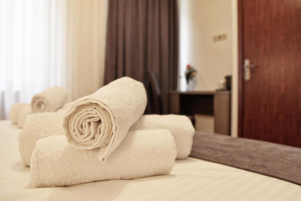 Postel nebo postele na pokoji v ubytování Hotel Four Brothers