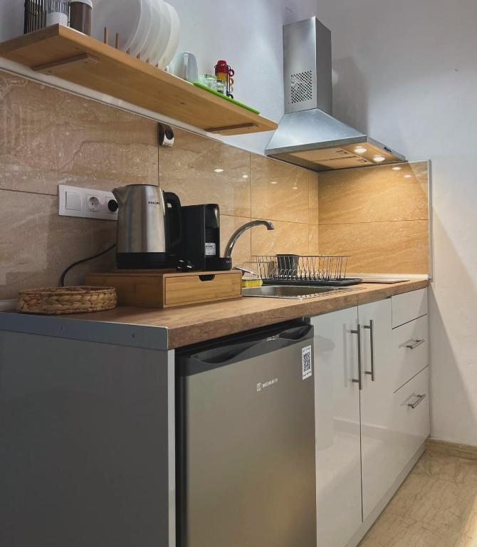 Kuchyň nebo kuchyňský kout v ubytování Yanna's Apartments