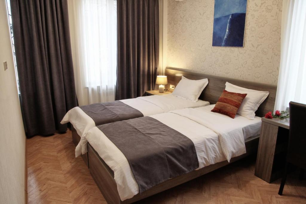 Postel nebo postele na pokoji v ubytování Hotel Four Brothers