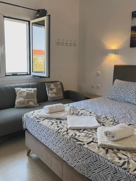 Postel nebo postele na pokoji v ubytování Yanna's Apartments
