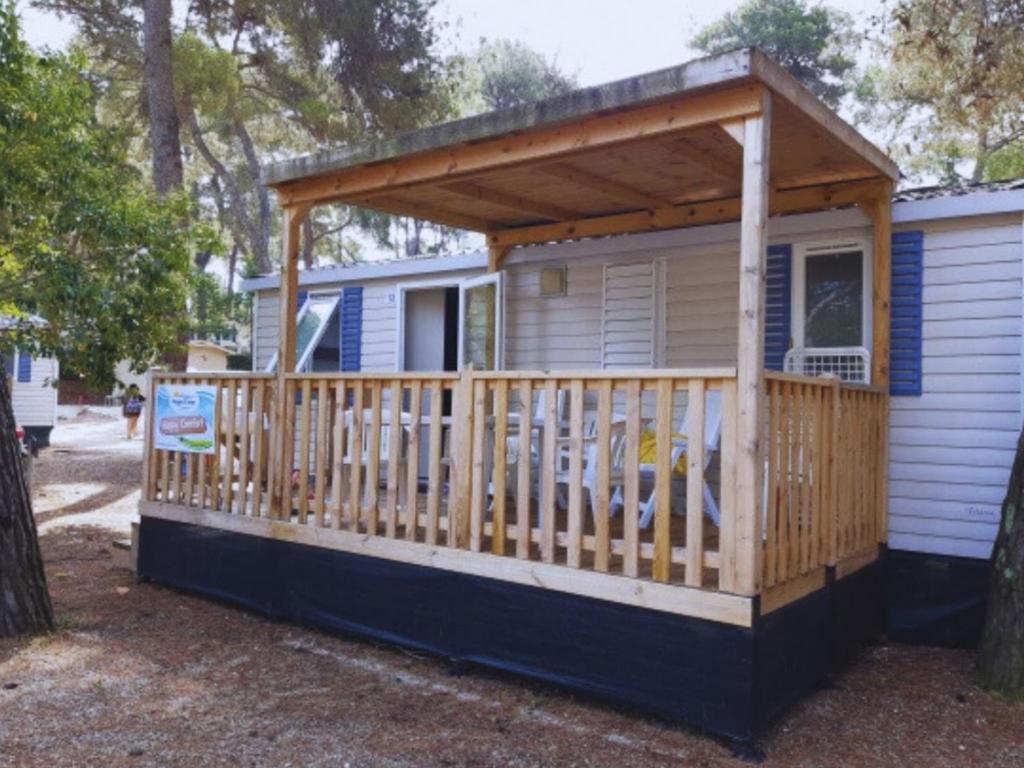 a house with a porch with a wooden deck at Holiday Home Il Pioppeto by Interhome in Vasto