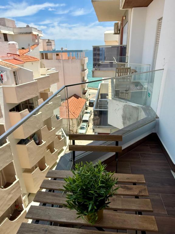 a balcony with a view of the ocean at Tomasoni summer house in Armação de Pêra