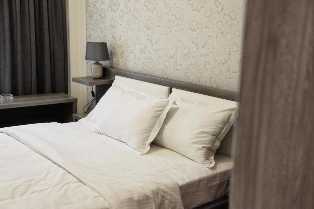 Postel nebo postele na pokoji v ubytování Hotel Four Brothers