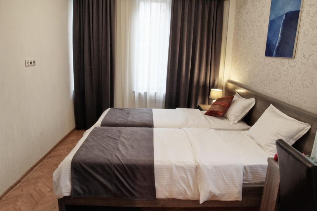 Postel nebo postele na pokoji v ubytování Hotel Four Brothers