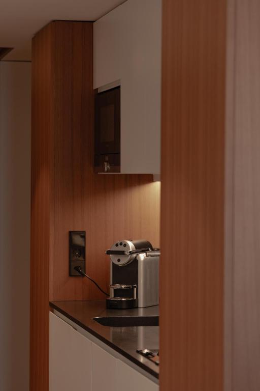 Kuchyň nebo kuchyňský kout v ubytování Fraser Suites Geneva - Serviced Apartments