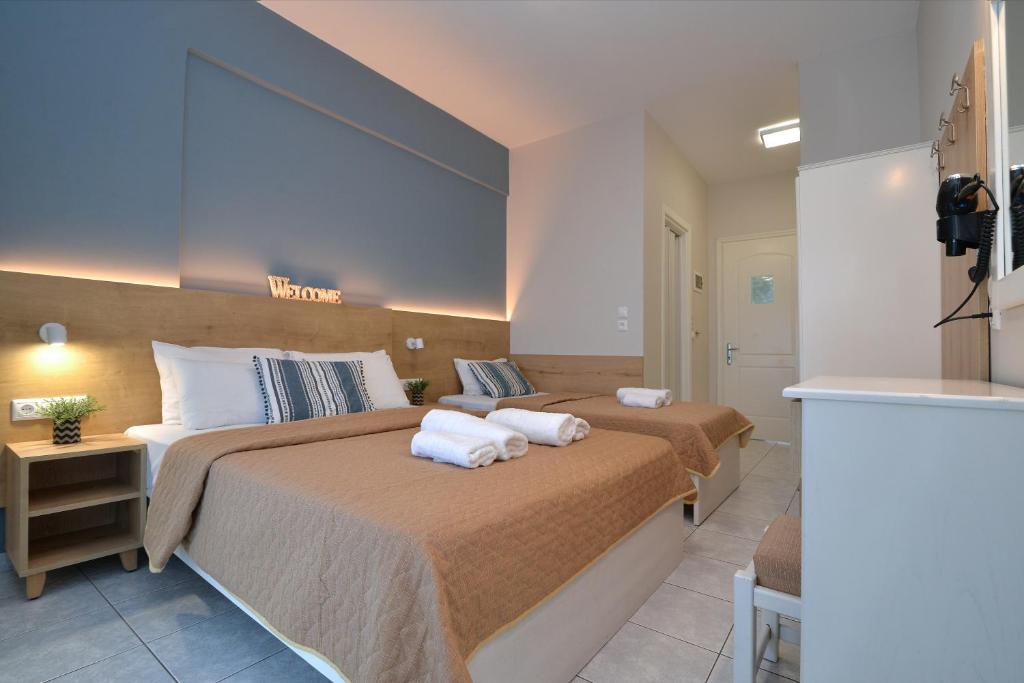 Postel nebo postele na pokoji v ubytování PERASMA ROOMS