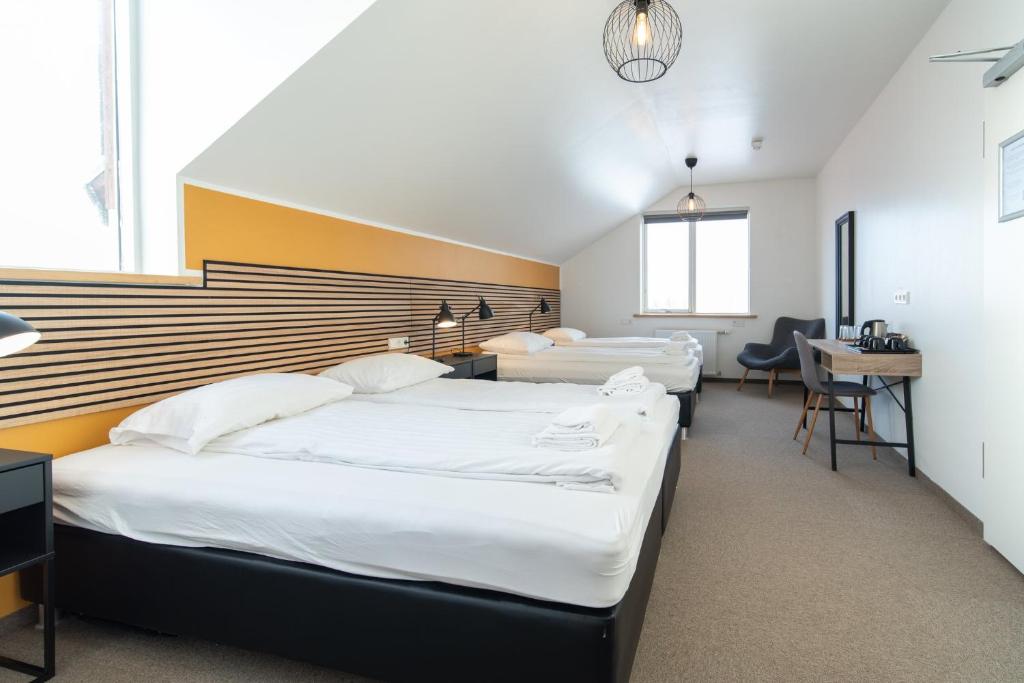 Postel nebo postele na pokoji v ubytování Adventure Hotel Hof
