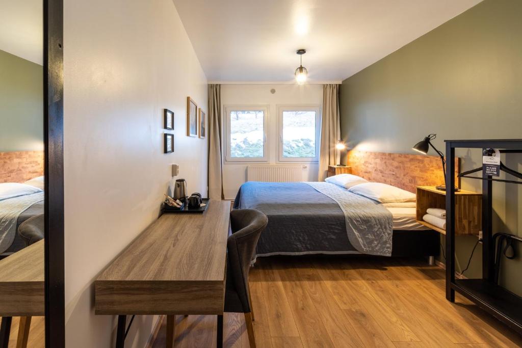 Postel nebo postele na pokoji v ubytování Adventure Hotel Hof