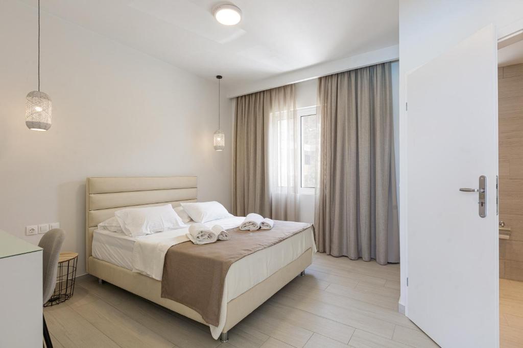 Posteľ alebo postele v izbe v ubytovaní Petres Villas