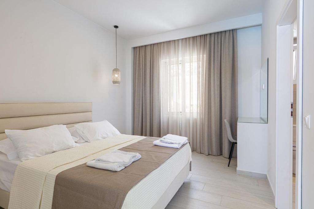 Posteľ alebo postele v izbe v ubytovaní Petres Villas