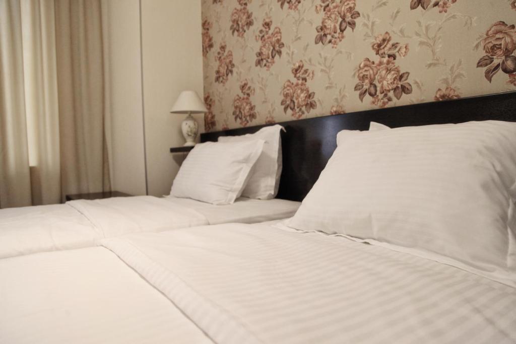 Postel nebo postele na pokoji v ubytování Hotel Four Brothers