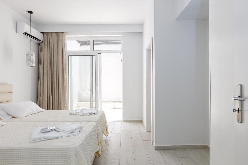 Posteľ alebo postele v izbe v ubytovaní Petres Villas