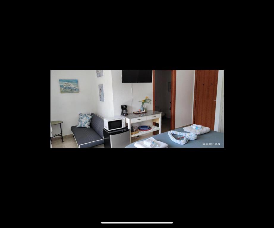 Posezení v ubytování Las Palmas room with terrace and private bathroom