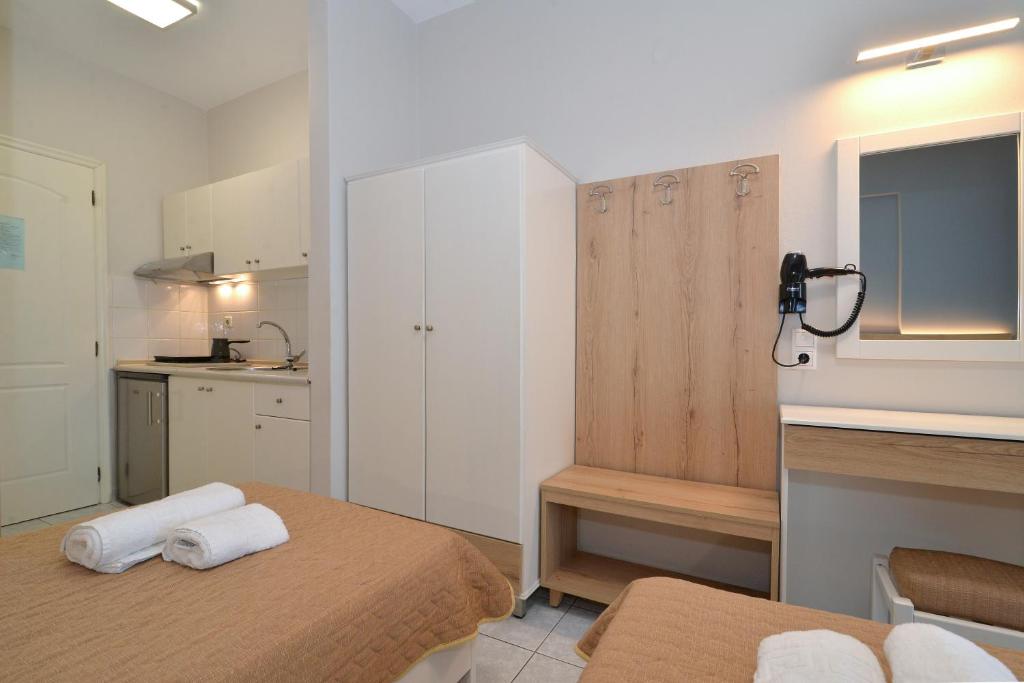 Postel nebo postele na pokoji v ubytování PERASMA ROOMS