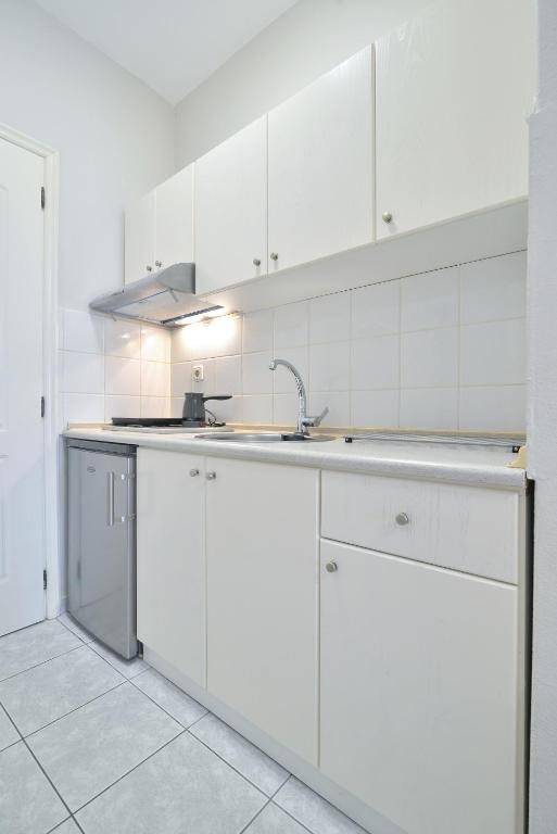 Kuchyň nebo kuchyňský kout v ubytování PERASMA ROOMS