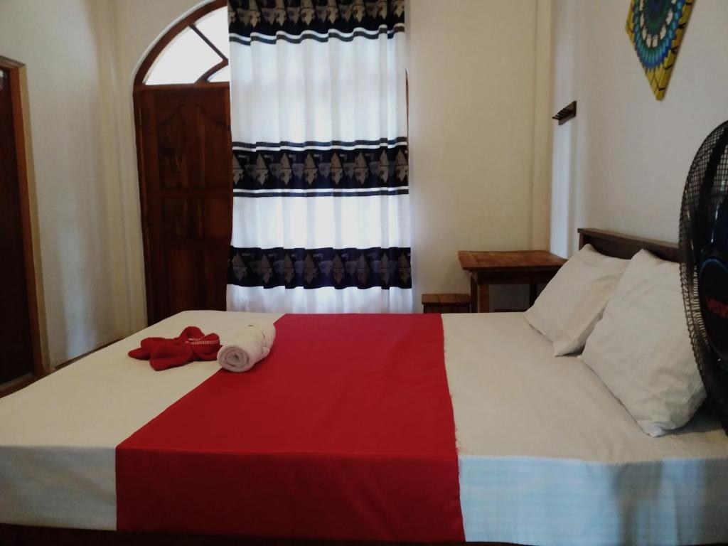 Postel nebo postele na pokoji v ubytování Villa Suriya