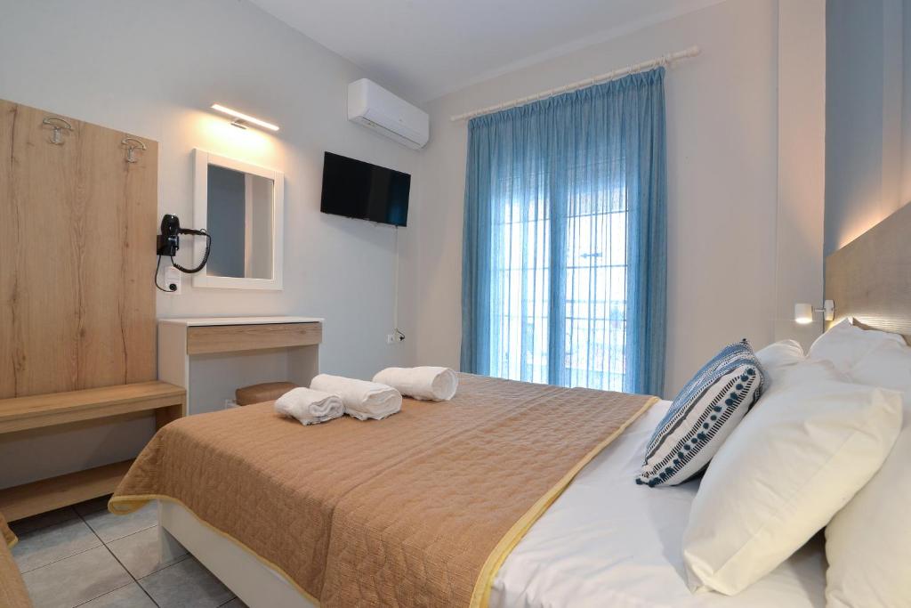 Postel nebo postele na pokoji v ubytování PERASMA ROOMS