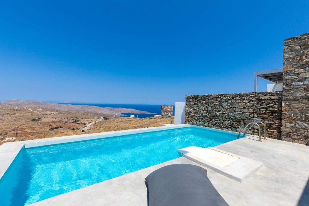 a villa with a swimming pool with a view at Windmills Kythnos in Kithnos