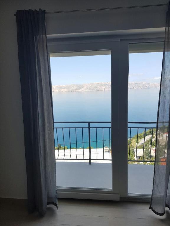 a view of the ocean from a window at Apartments Tereza in Senj
