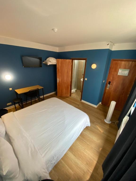 Postel nebo postele na pokoji v ubytování Hotel Windsor