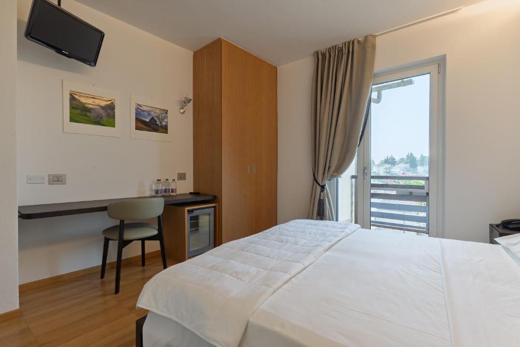 Postel nebo postele na pokoji v ubytování Hotel Pineta