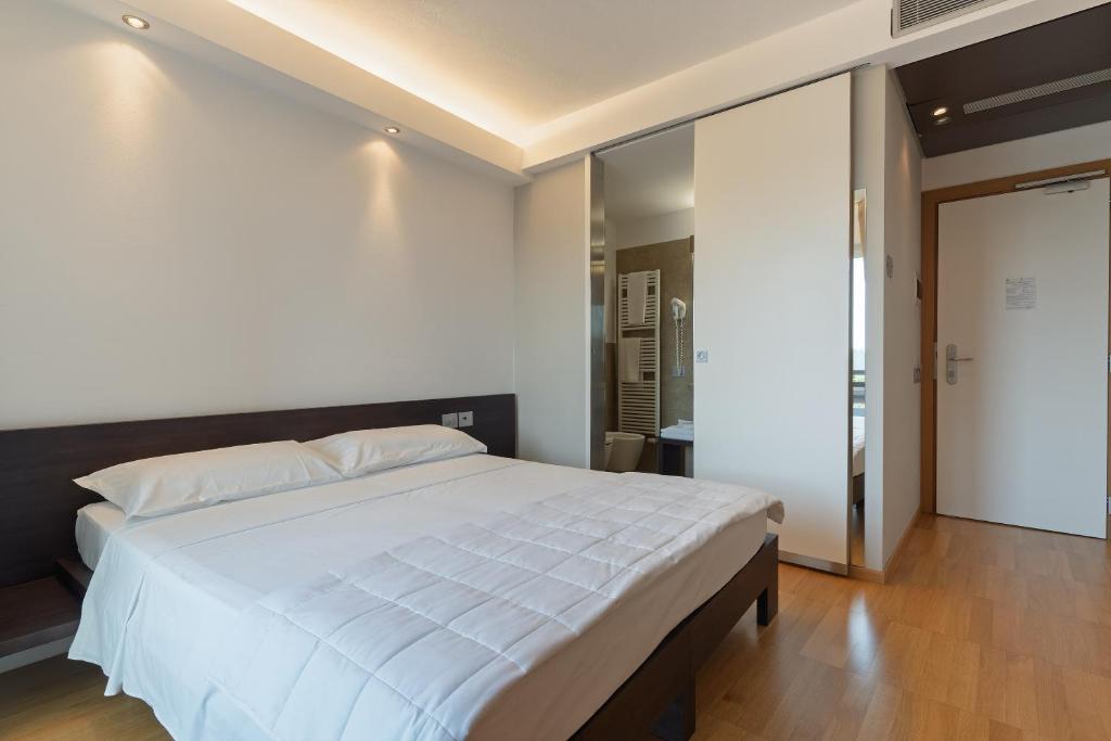 Postel nebo postele na pokoji v ubytování Hotel Pineta