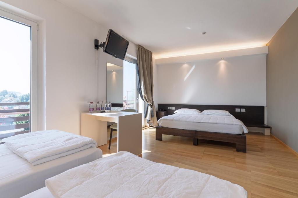 Postel nebo postele na pokoji v ubytování Hotel Pineta