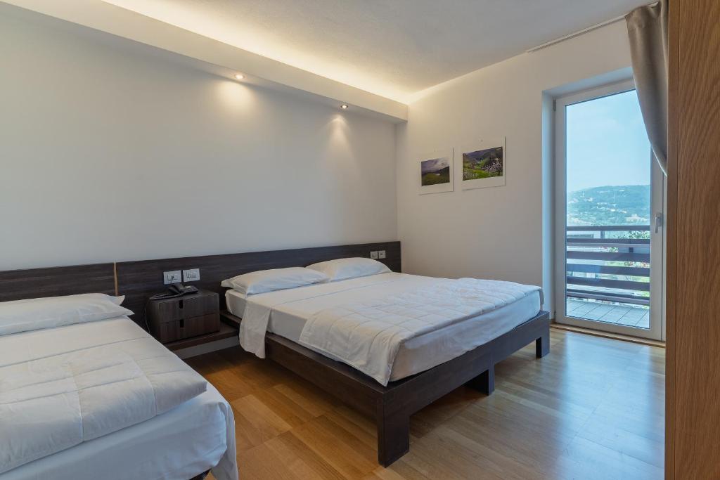 Postel nebo postele na pokoji v ubytování Hotel Pineta