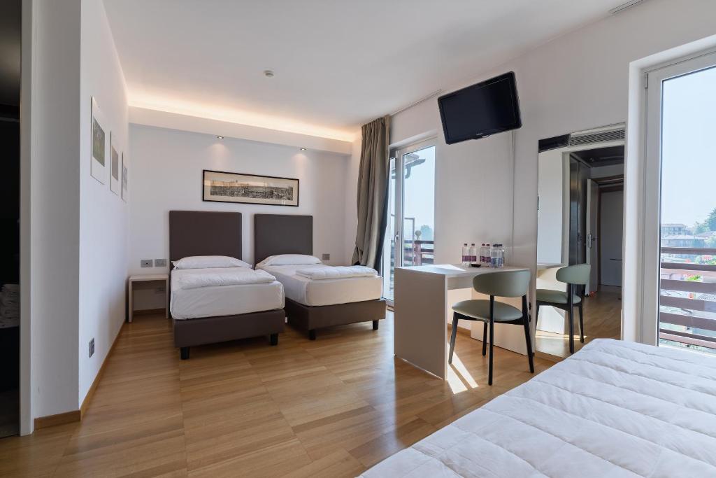 Postel nebo postele na pokoji v ubytování Hotel Pineta