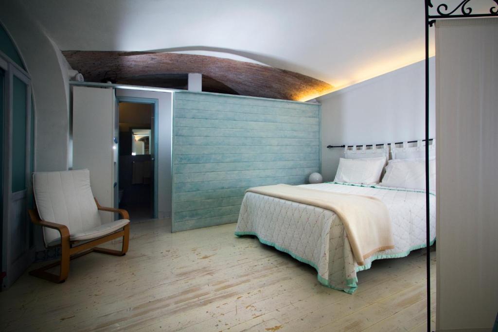 A bed or beds in a room at La Casa di Elisa