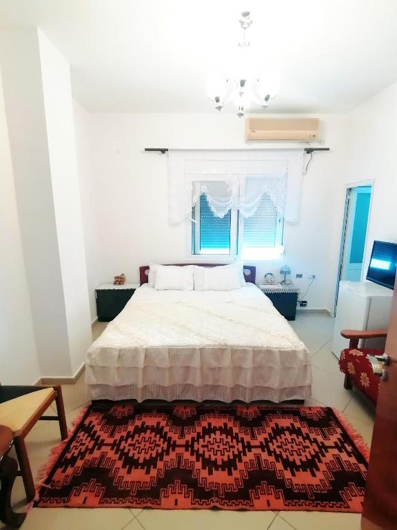 Postel nebo postele na pokoji v ubytování Vila Karagjozi