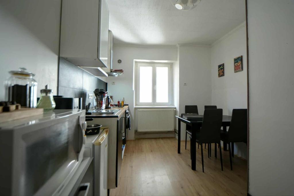 Kuchyň nebo kuchyňský kout v ubytování Appartement de caractère